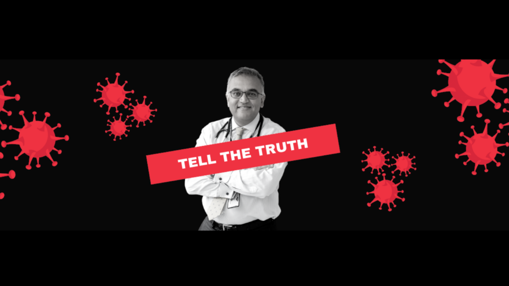 A photo of Ashish Jha smiling with arms folded is against a black background. Ilustrations of red viruses float nearby, and there's a red bar with white letters reading TELL THE TRUTH.